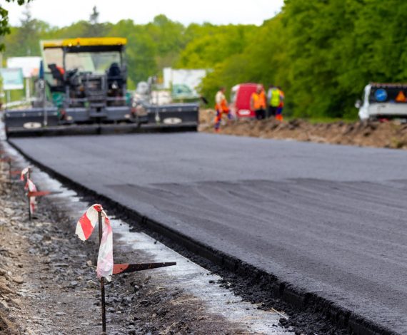 asphalt-paver-road-during-asphalt-laying-defocus-road-repair-laying-new-road